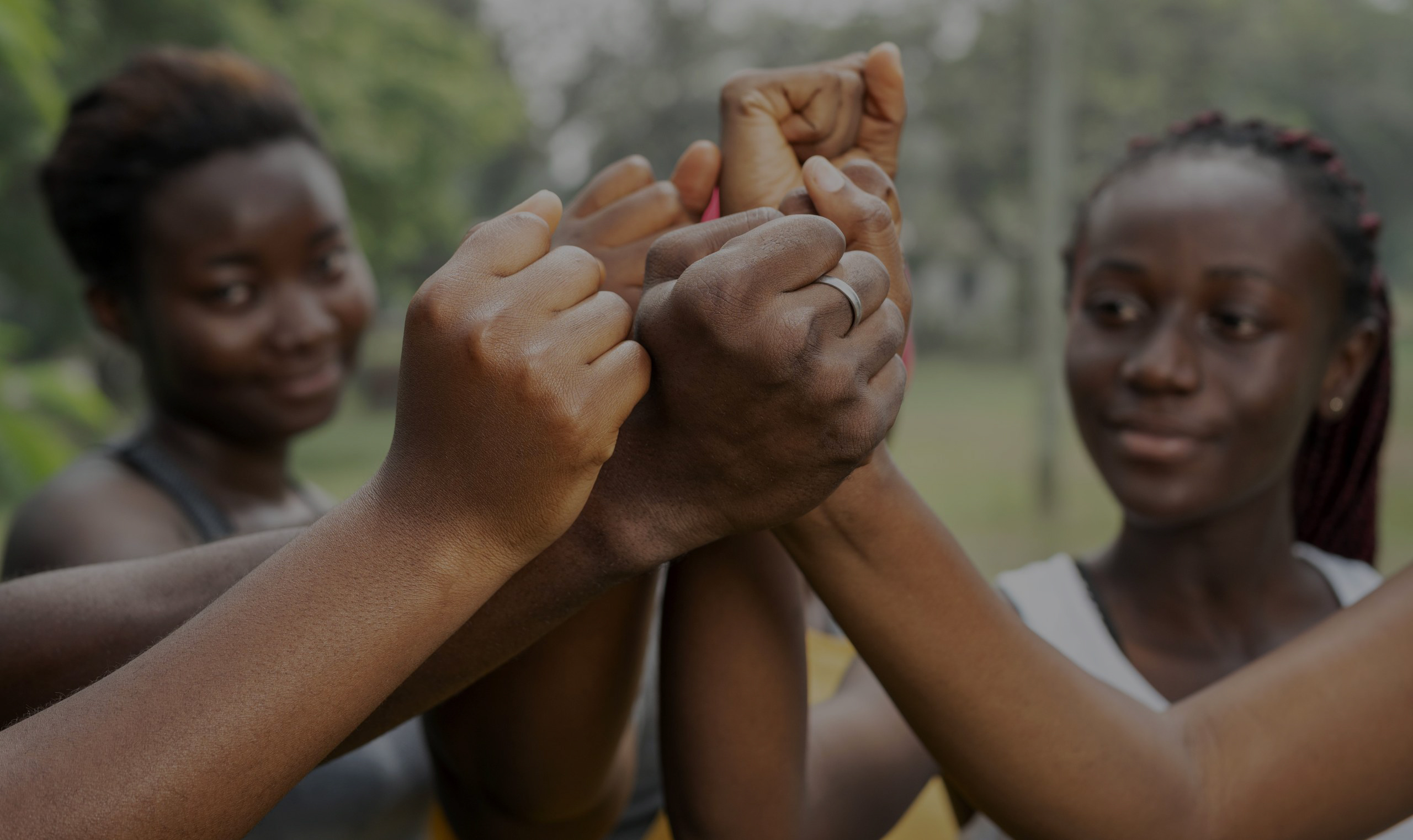 close-up-team-hand-shake-1-scaled